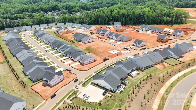 an outdoor space with pool and furniture