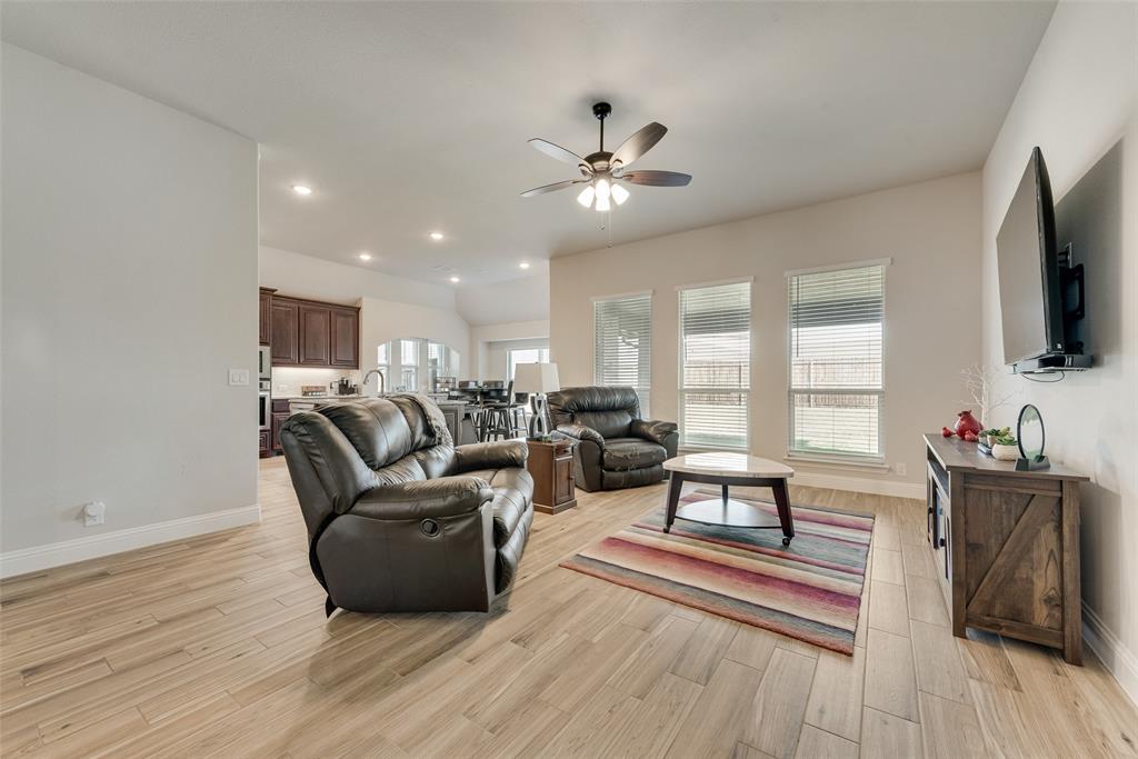 2010 Dundalk Lane Forney, TX 75126 - Photo 13 of 37 a living room with furniture and a flat screen tv