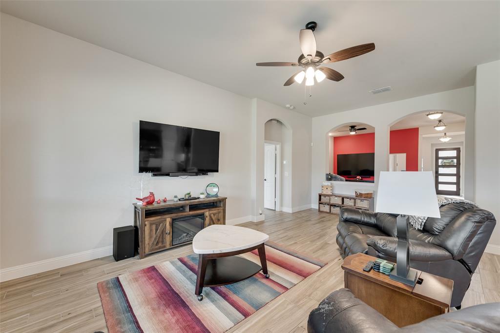 2010 Dundalk Lane Forney, TX 75126 - Photo 15 of 37 a living room with furniture and a flat screen tv