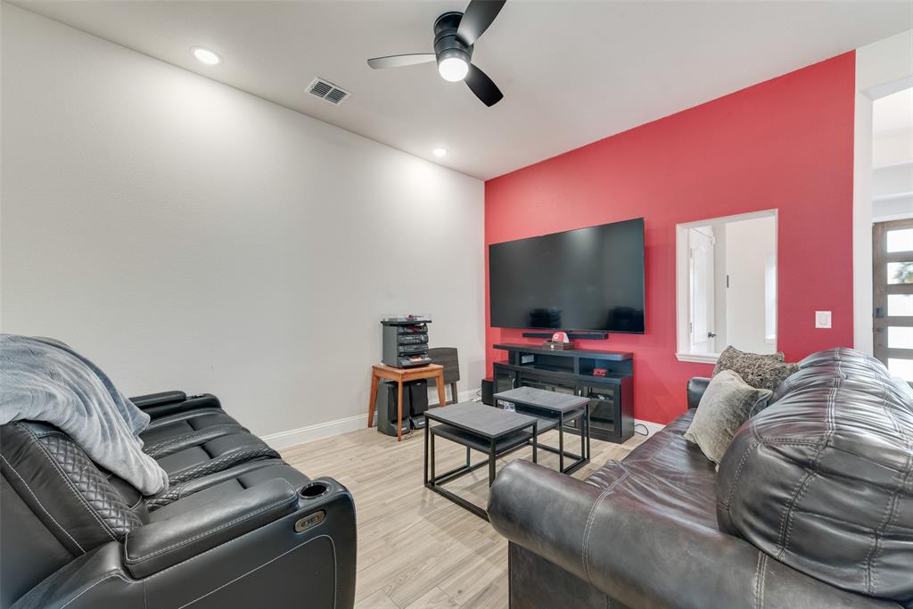 2010 Dundalk Lane Forney, TX 75126 - Photo 23 of 37 a living room with furniture and a flat screen tv