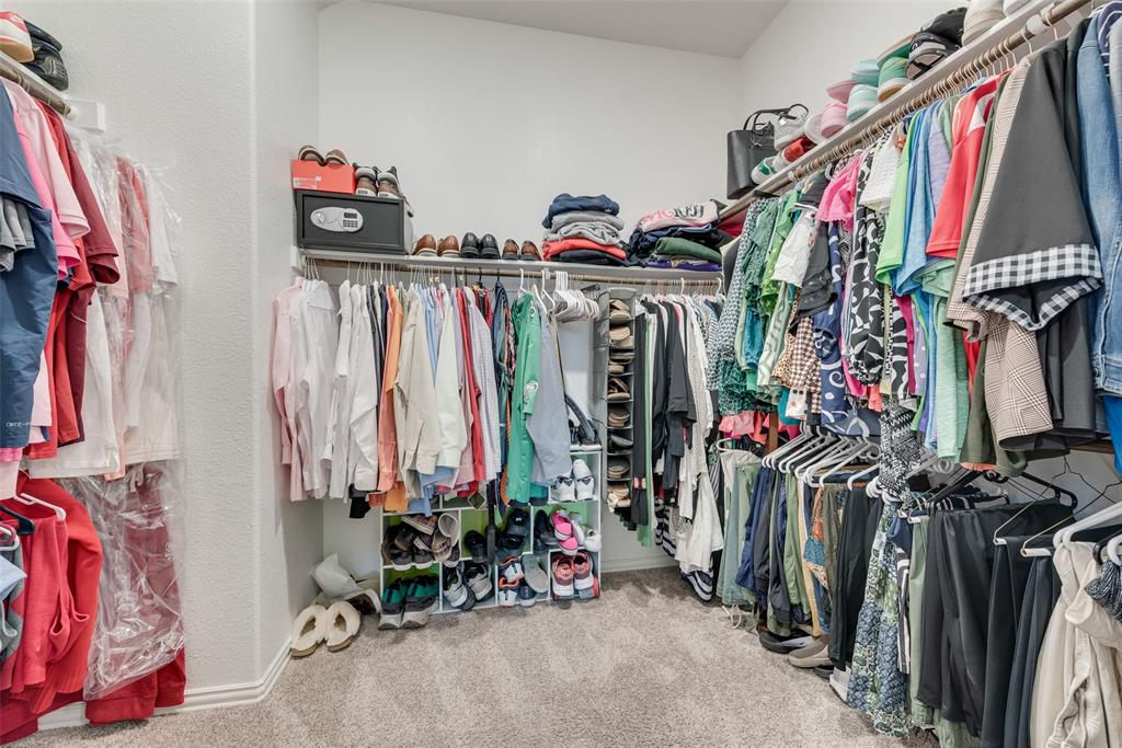 2010 Dundalk Lane Forney, TX 75126 - Photo 29 of 37 a view of walk in closet with clothes