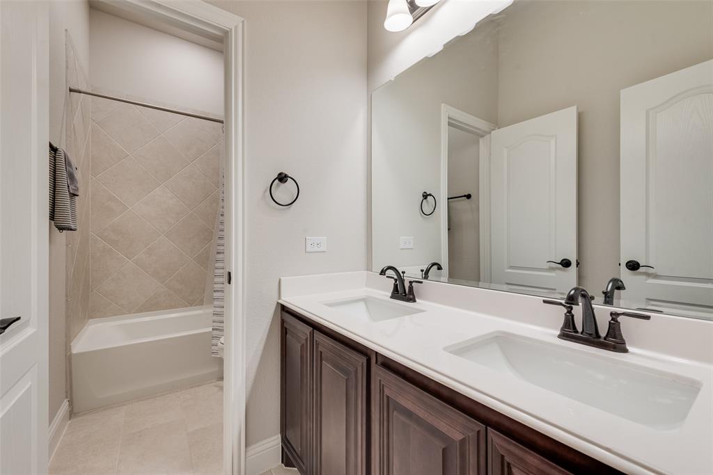 2010 Dundalk Lane Forney, TX 75126 - Photo 31 of 37 a bathroom with a sink and a mirror