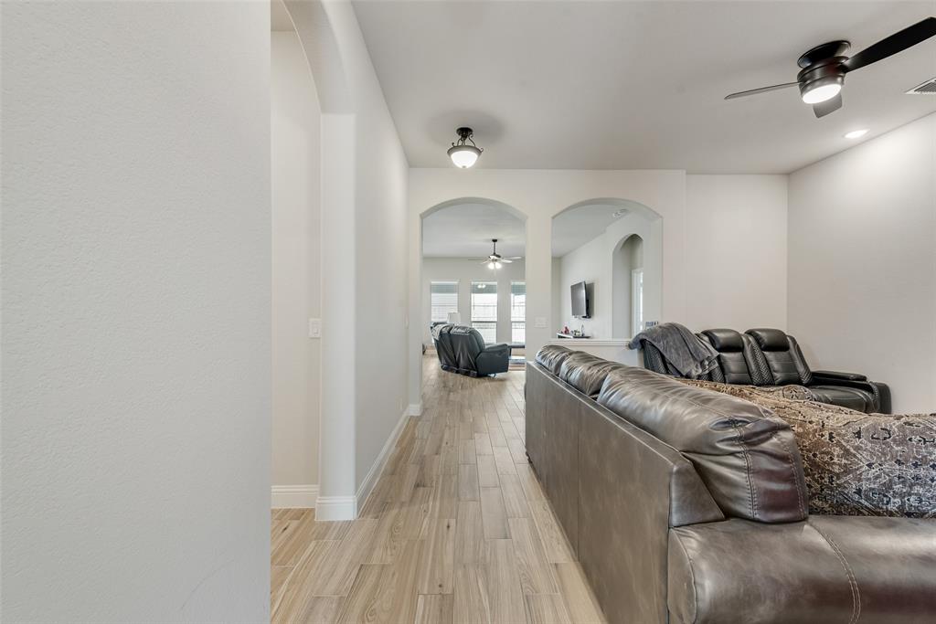2010 Dundalk Lane Forney, TX 75126 - Photo 9 of 37 a living room with furniture and a wooden floor
