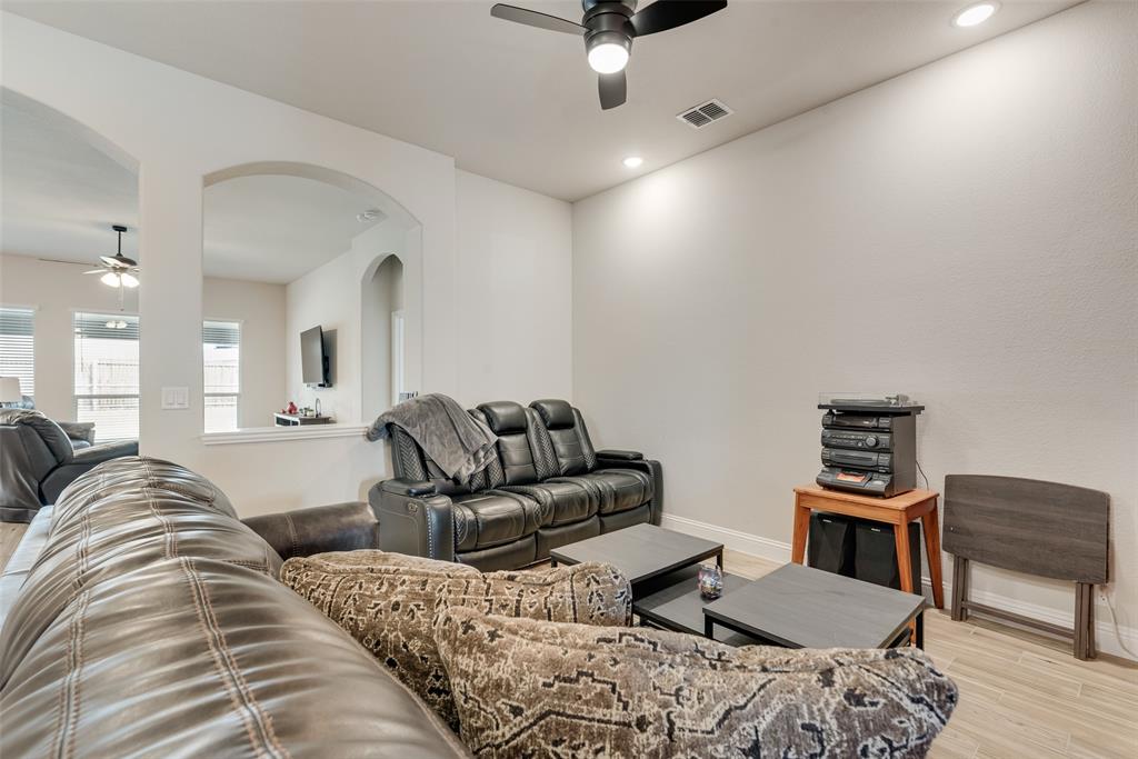2010 Dundalk Lane Forney, TX 75126 - Photo 10 of 37 a living room with furniture a couch and wooden floor