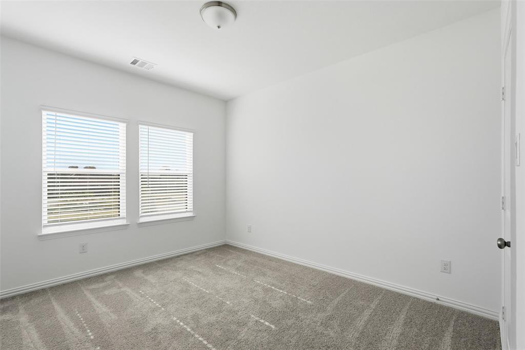 1203 Doris May Drive Allen, TX 75013 - Photo 14 of 35 an empty room with a window