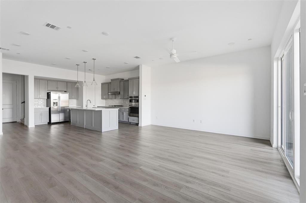 1203 Doris May Drive Allen, TX 75013 - Photo 20 of 35 a view of kitchen view wooden floor and window