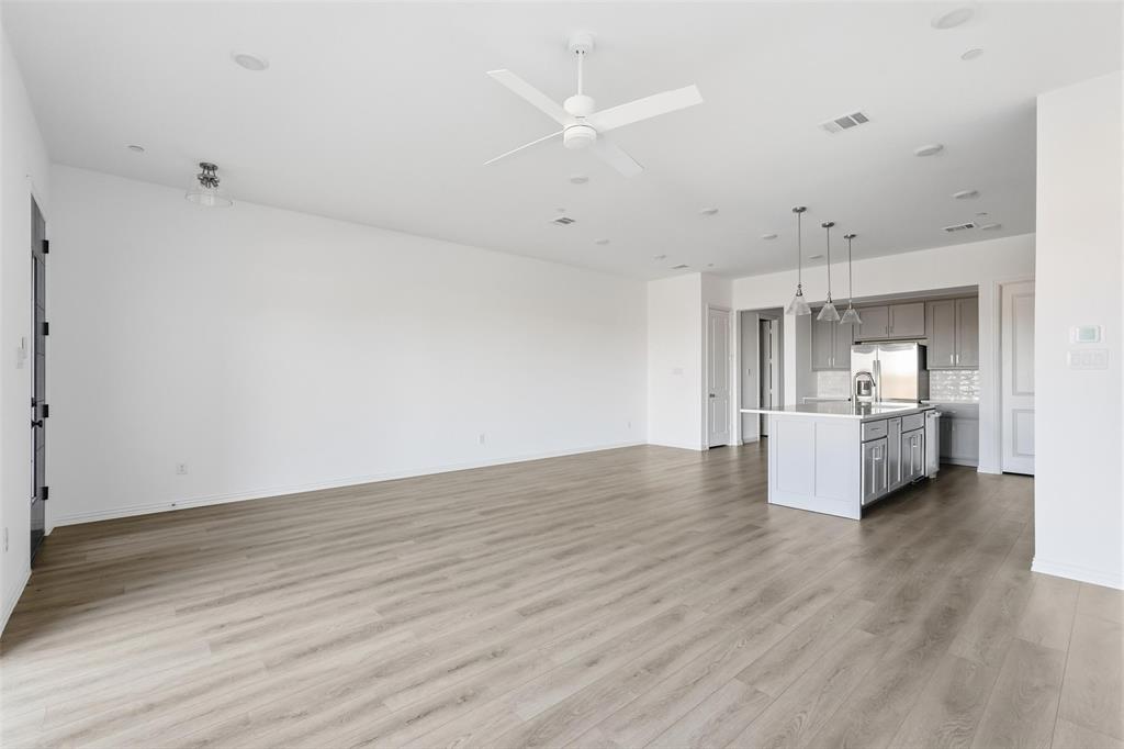 1203 Doris May Drive Allen, TX 75013 - Photo 21 of 35 a view of a kitchen with wooden floor