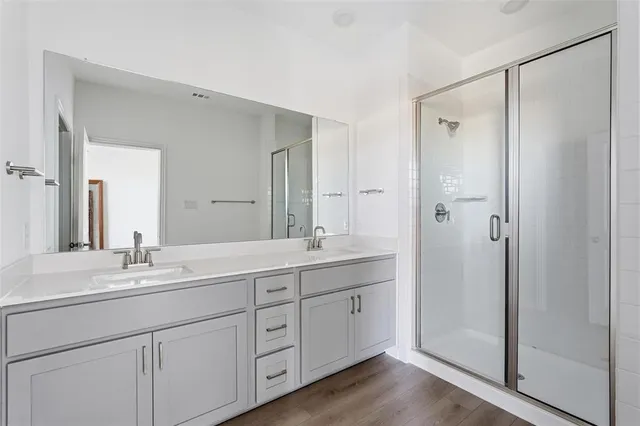 a bathroom with a double vanity sink mirror and double