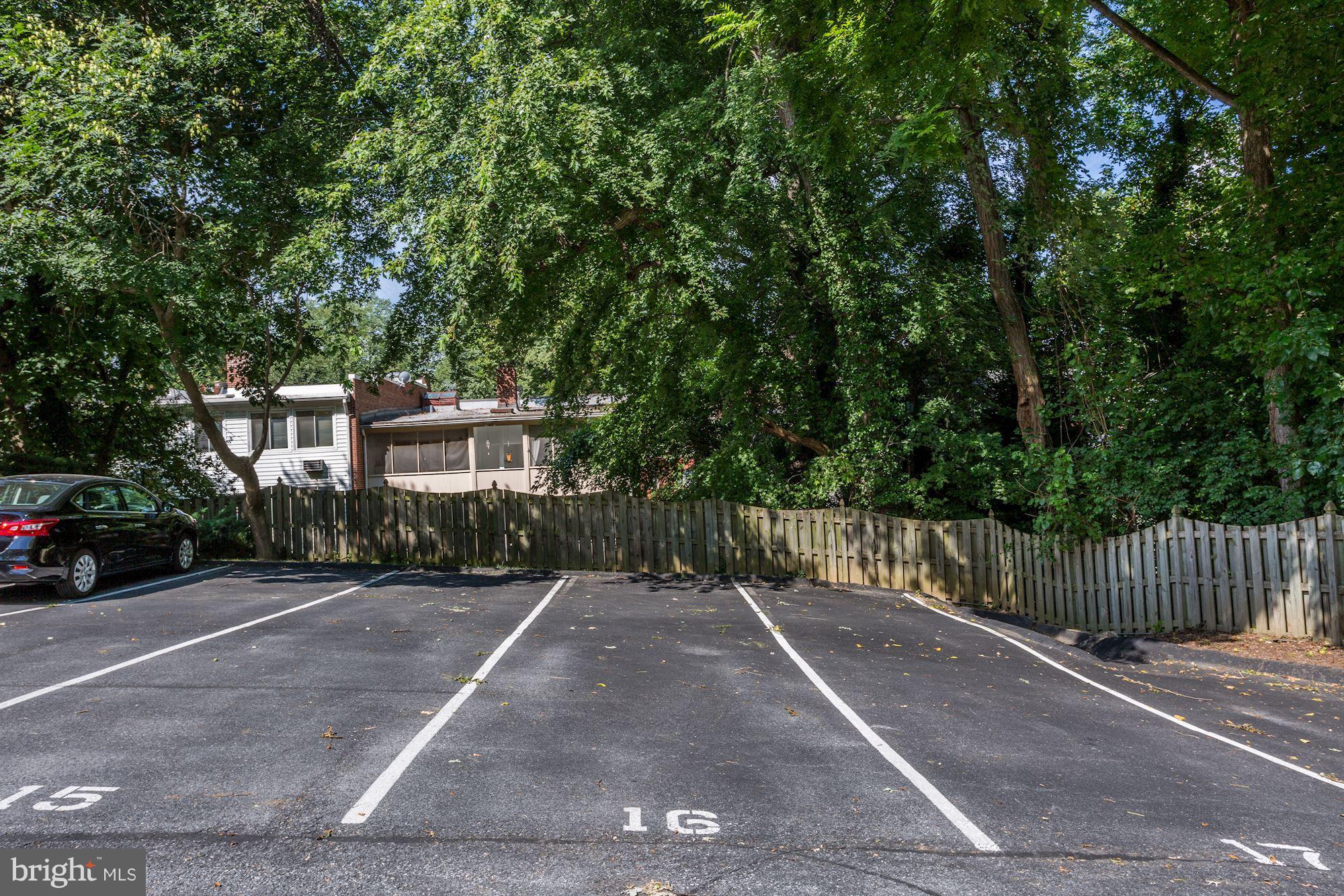 2604 Tunlaw Road Northwest, Unit 2 Washington, DC 20007 - Photo 20 of 25 a view of a street with a building and trees