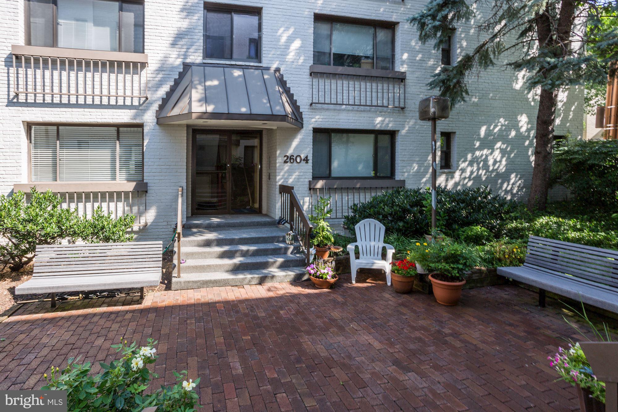 2604 Tunlaw Road Northwest, Unit 2 Washington, DC 20007 - Photo 21 of 25 front view of a house with a yard