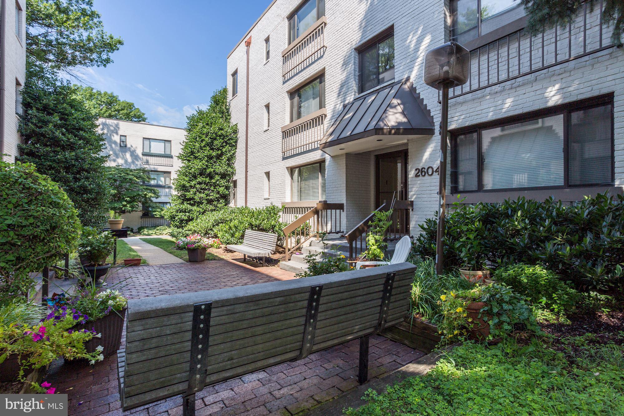 2604 Tunlaw Road Northwest, Unit 2 Washington, DC 20007 - Photo 24 of 25 a view of an outdoor sitting area with brick walls