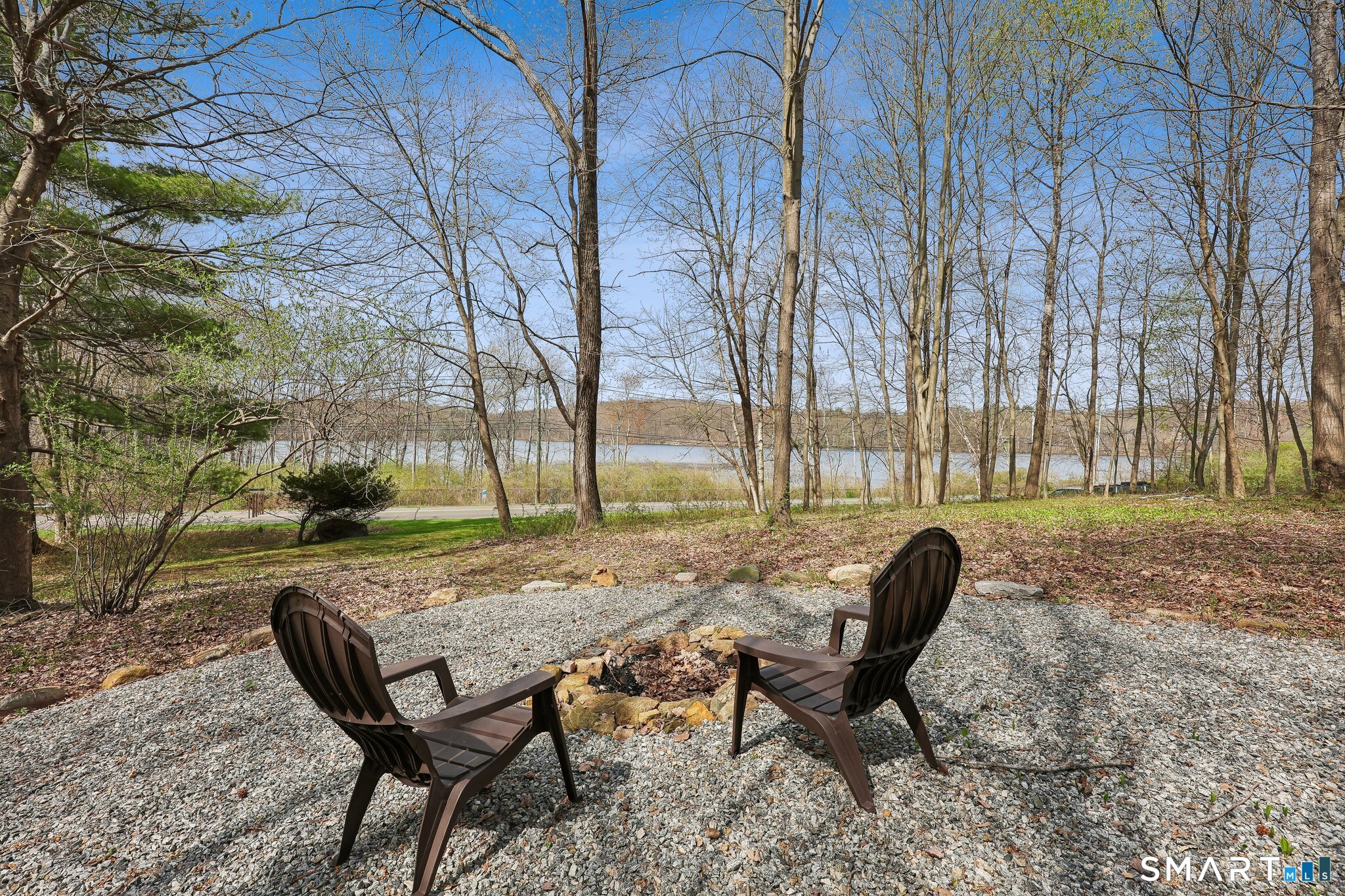3 East Lake Road Danbury, CT 06811 - Photo 3 of 37 The front yard firepit overlooks East Lake Reservoir for peaceful year-round water views.