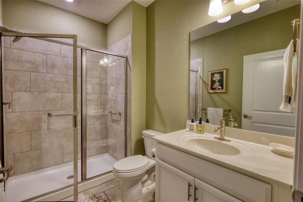 479 Glenmont Road Grayson, GA 30017 - Photo 11 of 58 a bathroom with a sink toilet and shower