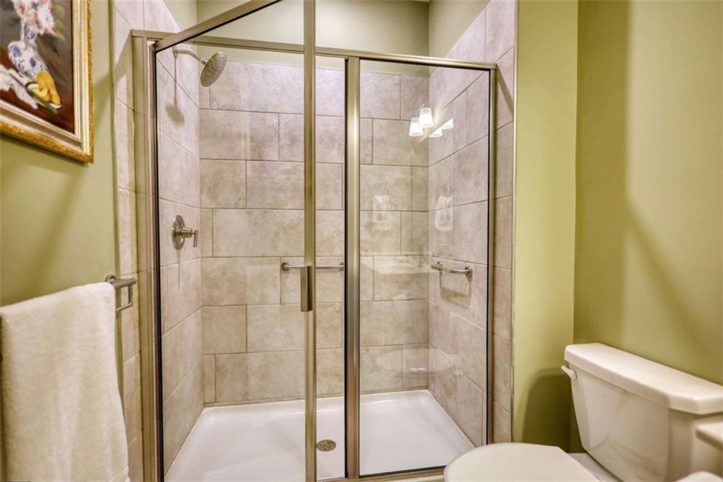 479 Glenmont Road Grayson, GA 30017 - Photo 12 of 58 a bathroom with a shower and toilet