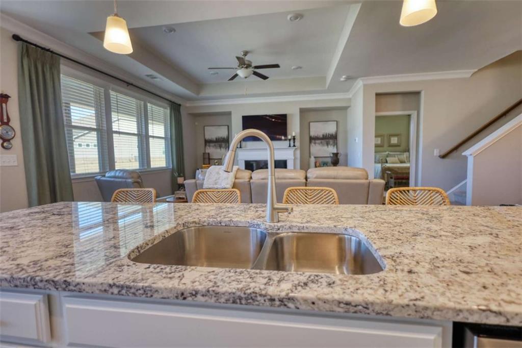 479 Glenmont Road Grayson, GA 30017 - Photo 29 of 58 a view of a kitchen countertops with a sink and chandelier