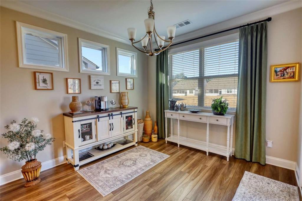 479 Glenmont Road Grayson, GA 30017 - Photo 31 of 58 a kitchen that has a lot of white cabinets a sink and stainless steel appliances