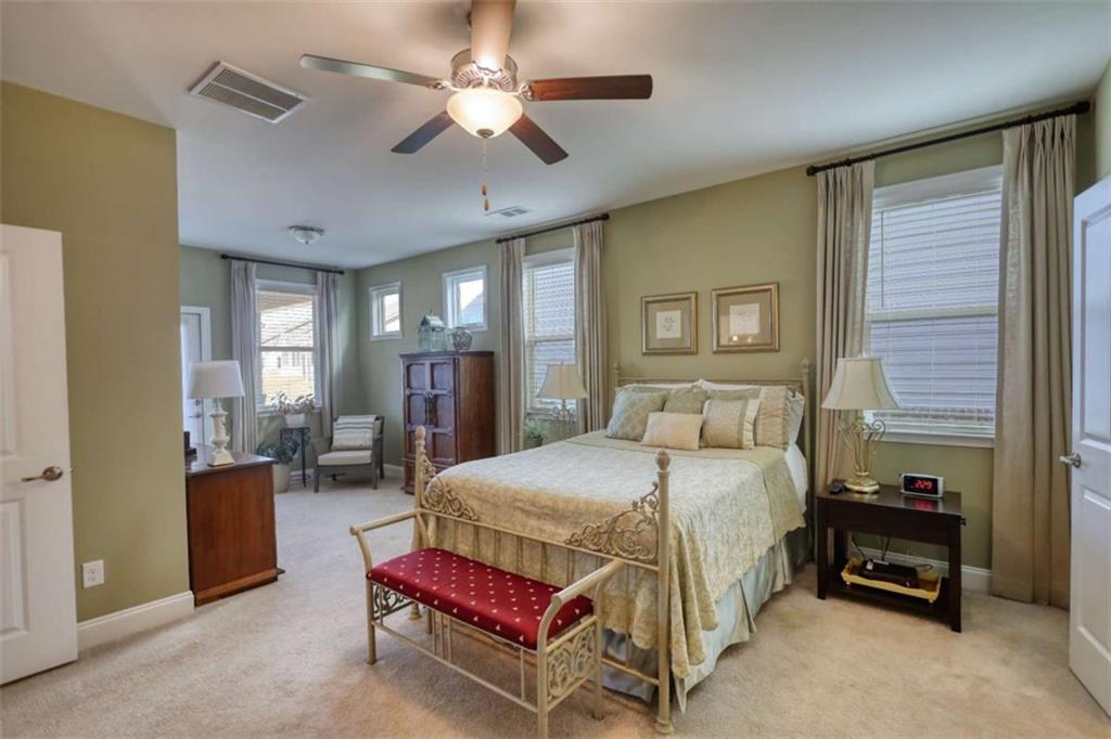 479 Glenmont Road Grayson, GA 30017 - Photo 33 of 58 a bedroom with a bed gym equipment and a large window