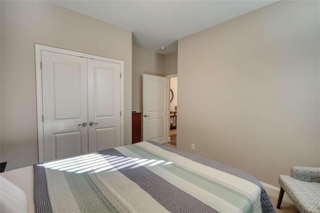 479 Glenmont Road Grayson, GA 30017 - Photo 4 of 58 a bedroom with a bed and a cabinets