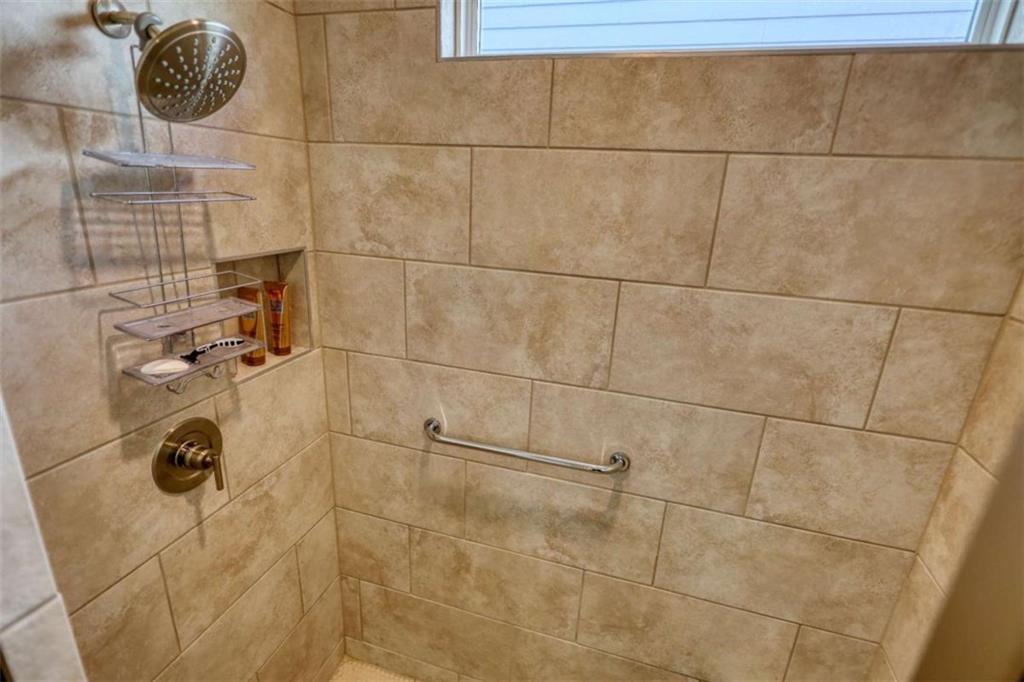 479 Glenmont Road Grayson, GA 30017 - Photo 43 of 58 a bathroom with a shower