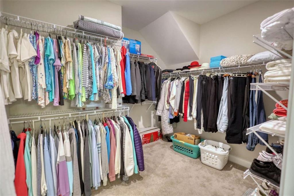 479 Glenmont Road Grayson, GA 30017 - Photo 46 of 58 a view of walk in closet with clothes
