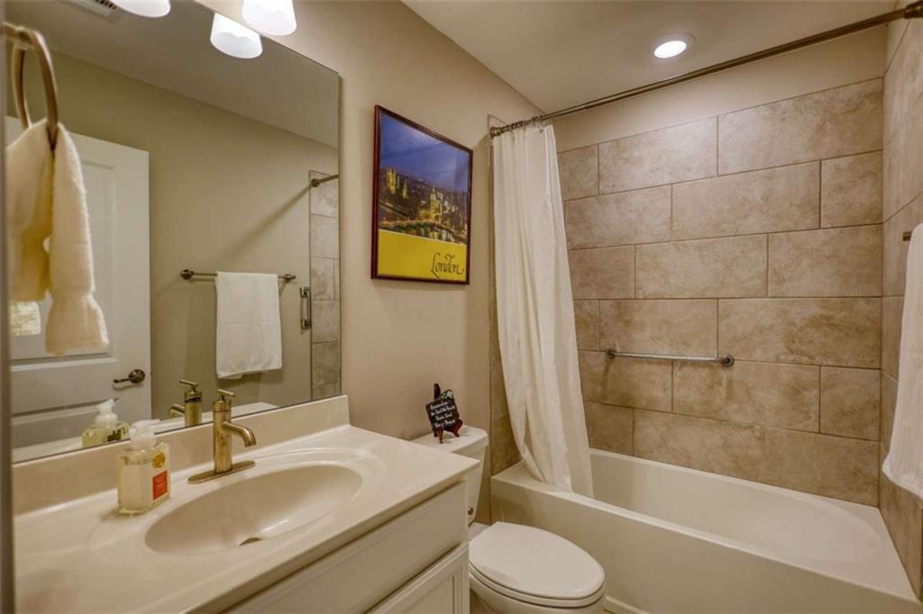479 Glenmont Road Grayson, GA 30017 - Photo 50 of 58 a bathroom with a sink toilet and shower