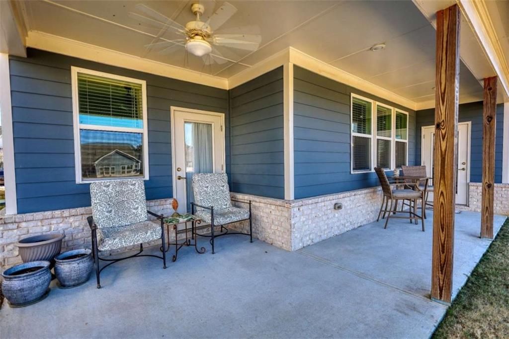 479 Glenmont Road Grayson, GA 30017 - Photo 54 of 58 a view of a patio with chairs and potted plants