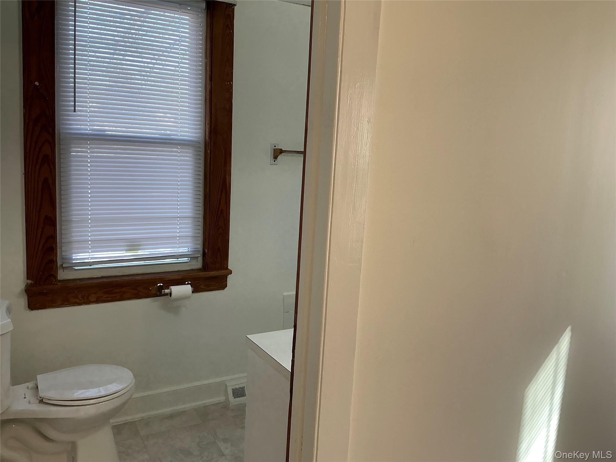 45 Fulton Avenue, Unit 2 Poughkeepsie, NY 12603 - Photo 13 of 15 Bathroom with toilet and vanity