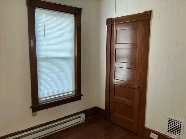 a room with closet and wooden floor