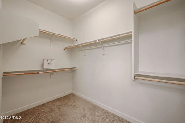 a view of an empty walk in closet