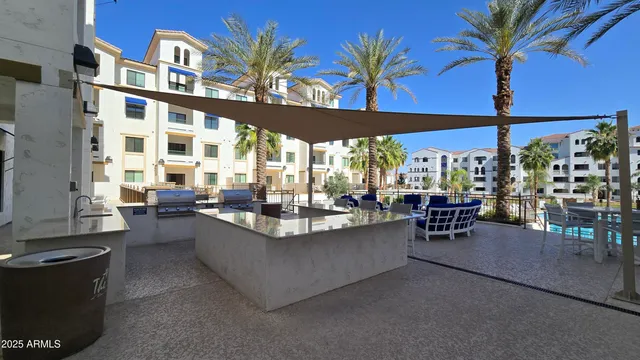 a view of a patio with dining table and chairs