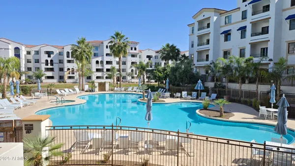 a view of a swimming pool with a patio