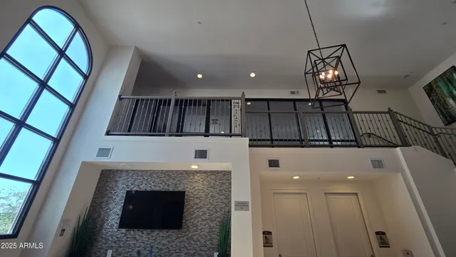 a view of hall way with furniture and fireplace