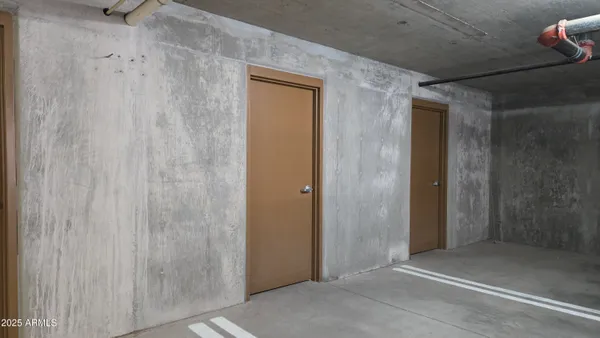 a view of parking garage with cars