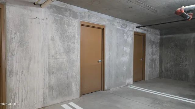 a view of parking garage with cars