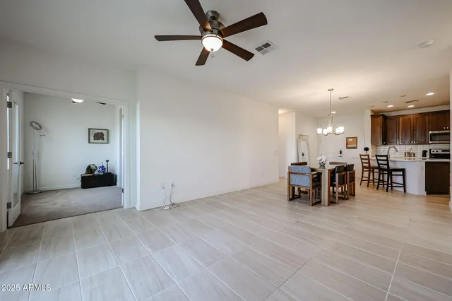 a view of a livingroom with furniture and a ceiling fan