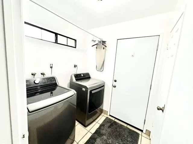 a kitchen with a refrigerator and a stove