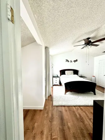 a bedroom with a bed and a cabinets