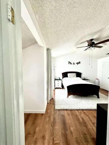 a bedroom with a bed and a cabinets