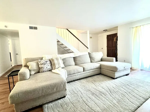 a living room with furniture and a couch