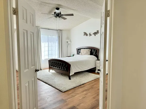 a bedroom with a bed and window