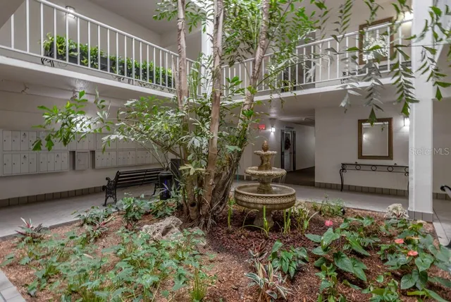 a room that has a bed and a table in it