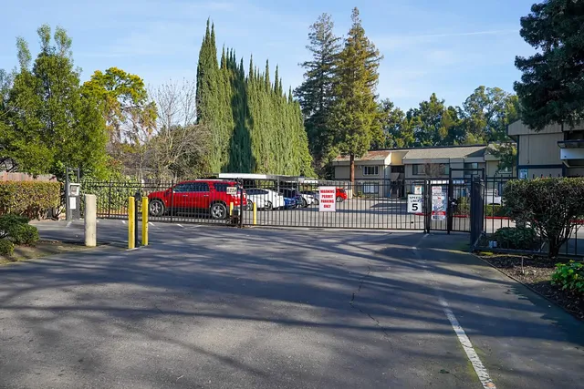 a childrens park with lots of swings and slides