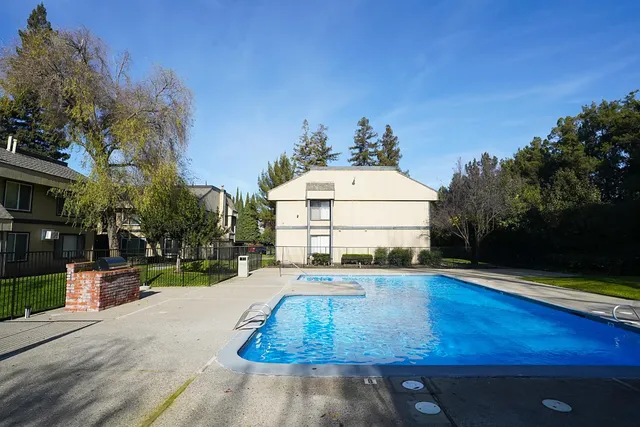a view of a swimming pool with a patio
