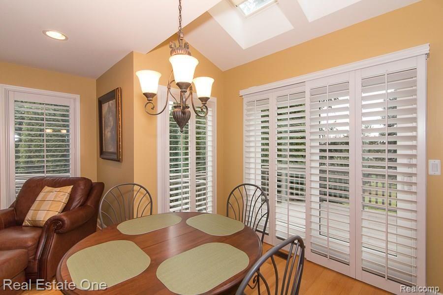 6376 Peach Tree Court Rochester, MI 48306 - Photo 7 of 27 Eating Area in Kitchen with Skylights and Hunter Douglas Window Shutters