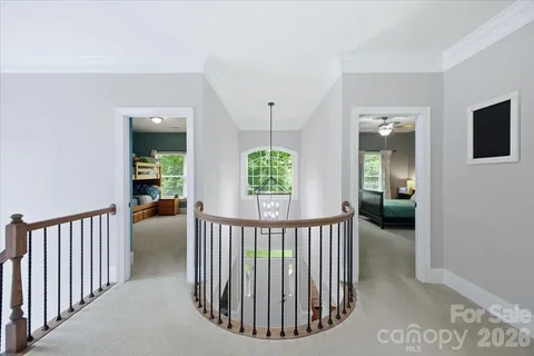 a view of a hallway from a livingroom with furniture