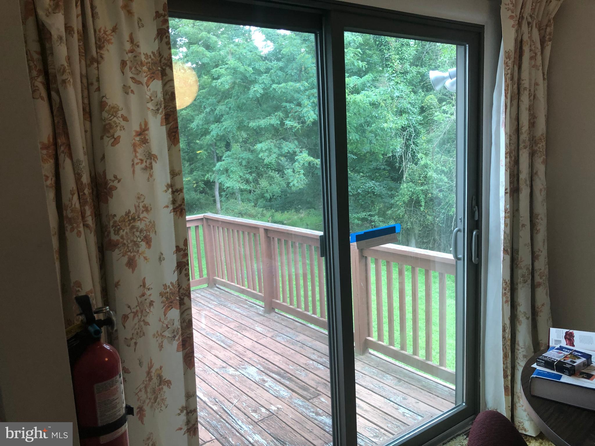 6328 Sandchain Road Columbia, MD 21045 - Photo 23 of 47 Sliding glass doors off the kitchen to the deck