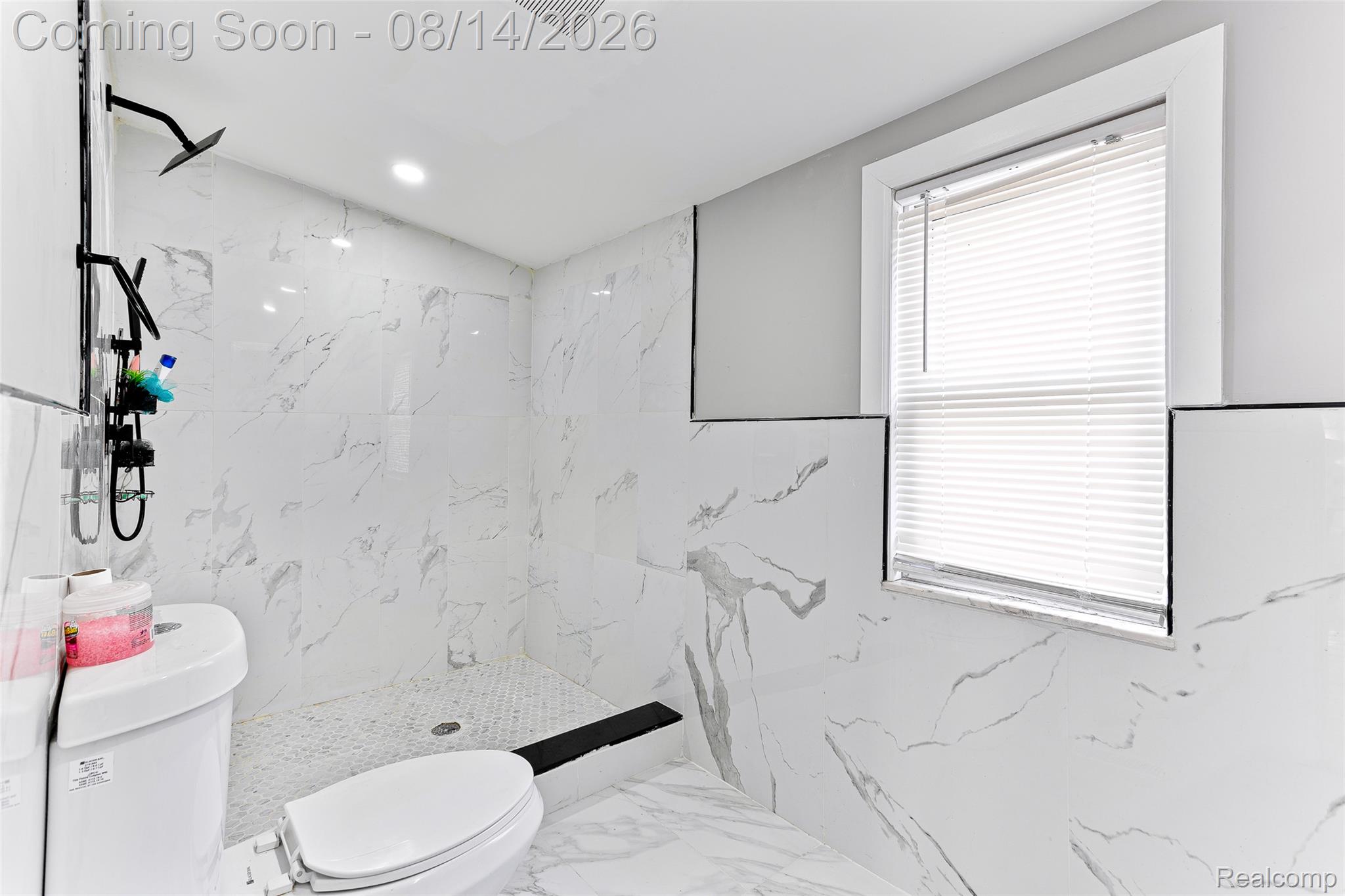 4472 French Road Detroit, MI 48214 - Photo 10 of 23 Walk-in shower with black-finish fixtures, white tile walls and flooring, and recessed lighting