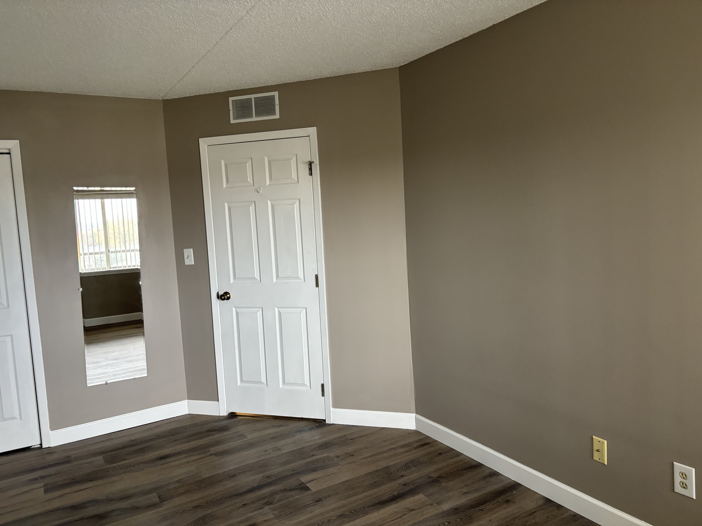 1133 North 7th Street, Unit 608 Rochelle, IL 61068 - Photo 23 of 43 an empty room with wooden floor and closet