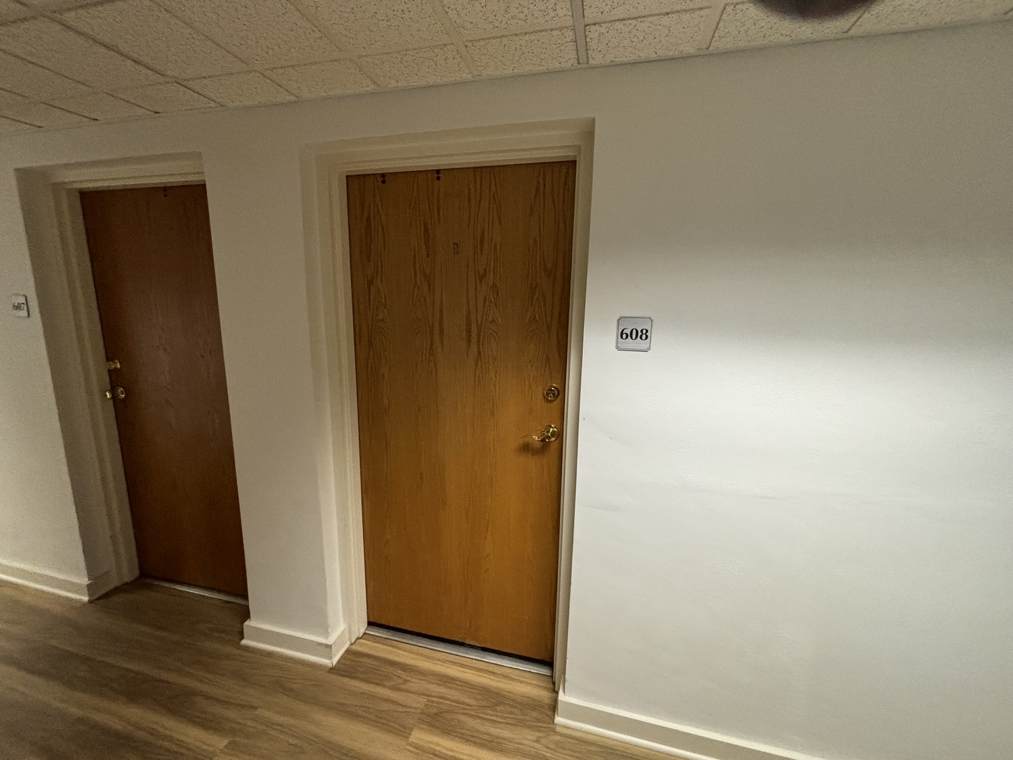 1133 North 7th Street, Unit 608 Rochelle, IL 61068 - Photo 8 of 43 an empty room and wooden door