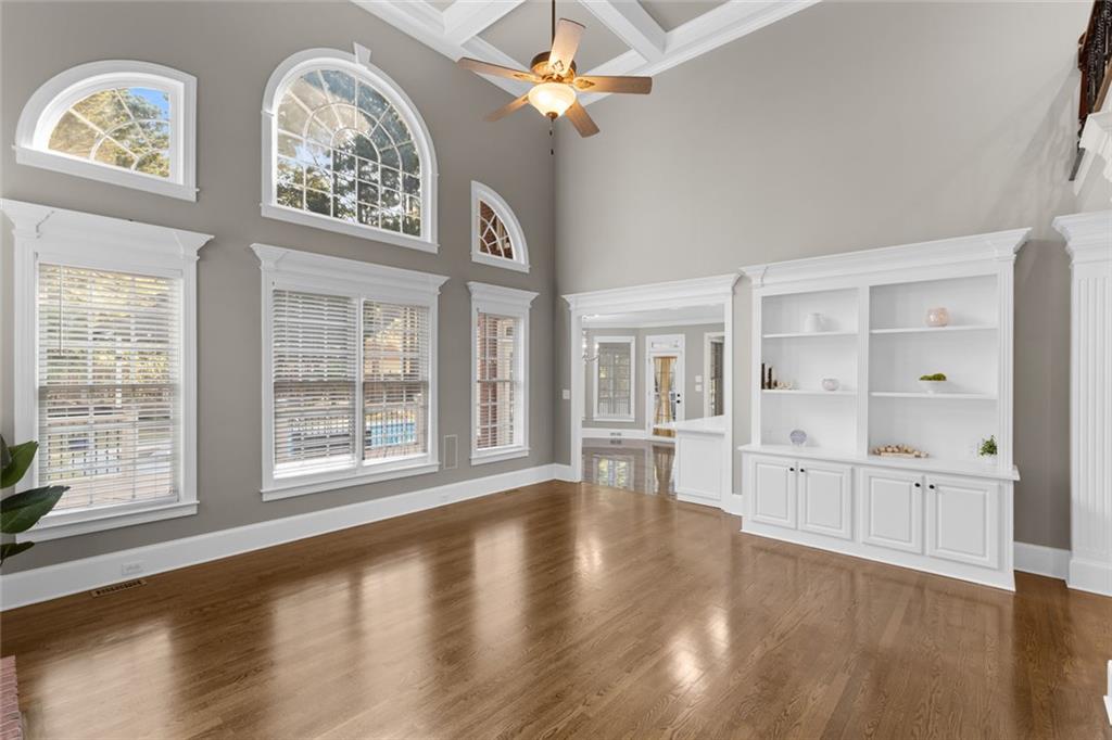 1225 Mobile Way Grayson, GA 30017 - Photo 12 of 51 a view of an empty room with a window and wooden floor